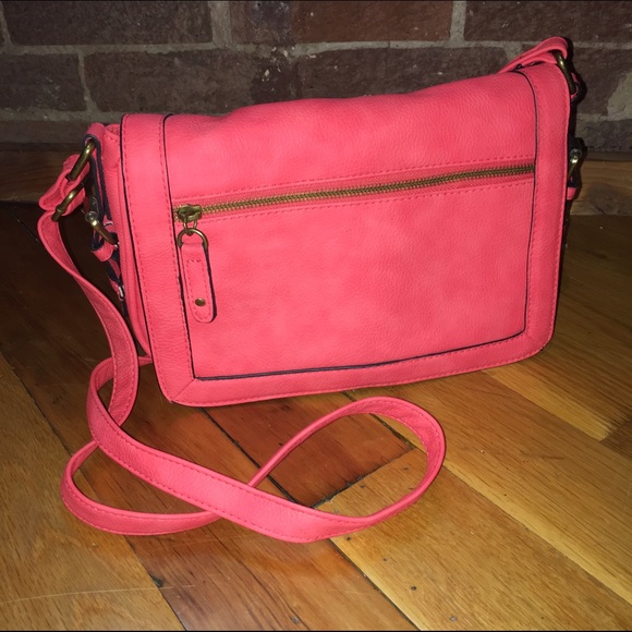 Coral purse with long strap.