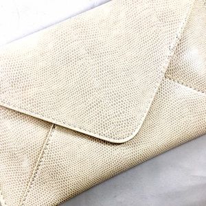 Clarins faux leather envelope clutch