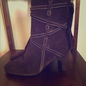 Cute brown suede boots with fringe.