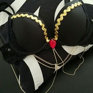Black rave bra with gold chains and red gem