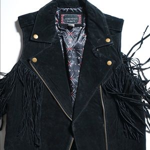 Black swede vest with fringe detail.
