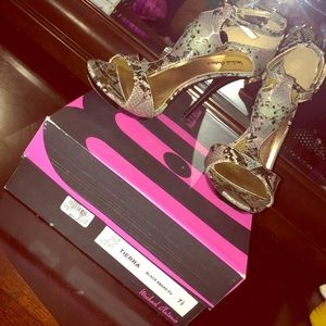 Michael Antonio 7 1/2 black & gold snake pumps.