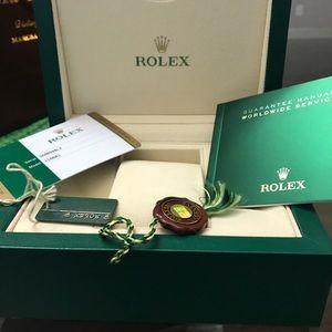 Modern Authentic Rolex Box with leather booklet.