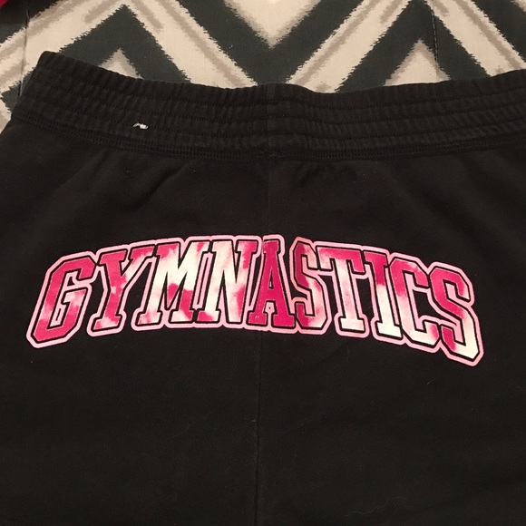 Black and pink "Gymnastics" shorts