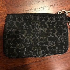 Black and silver coach wristlet