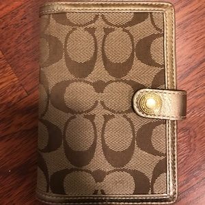 Brown and gold coach wallet