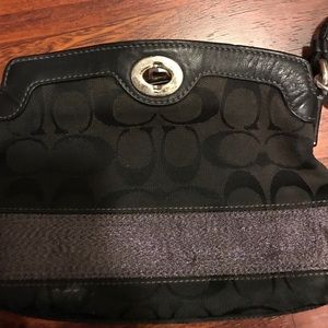 Black and silver coach wristlet
