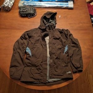 REI brown waterproof jacket