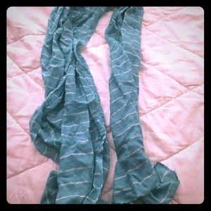 A teal with silver sparkles stripped scarf!