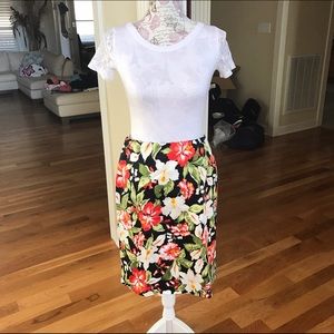 White tee &s A-line skirt.