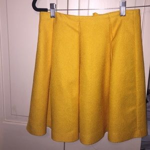 Yellow pleated skirt