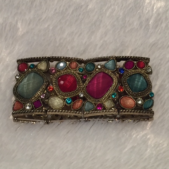 Gold bracelet with jewel tone stones