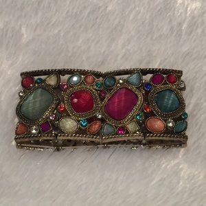 Gold bracelet with jewel tone stones