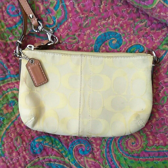 Canary yellow coach wristlet