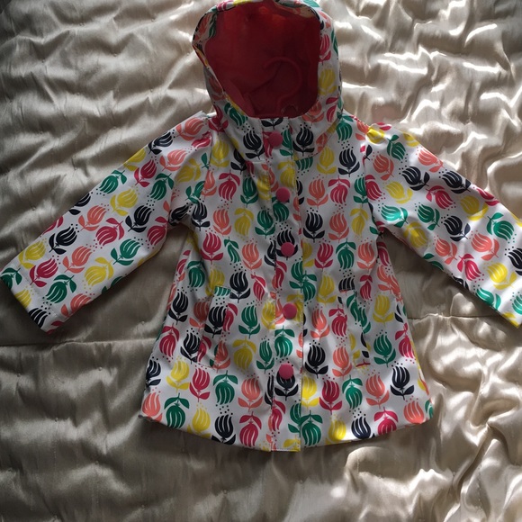 NEW - Raincoat with lining and a hood.