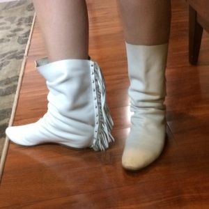 White leather boots with tassels