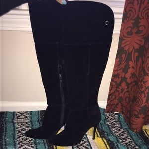 Tall black suede boots