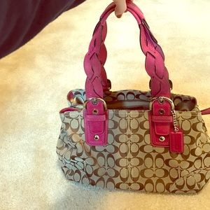 Coach pink and tan purse.
