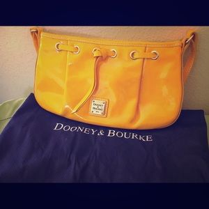 Brand new yellow Dooney & Bourke purse.