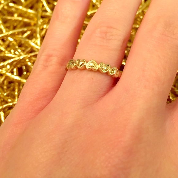 14 karat gold ring with hearts detail.