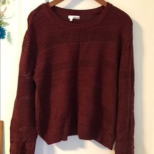 Maroon sweater.