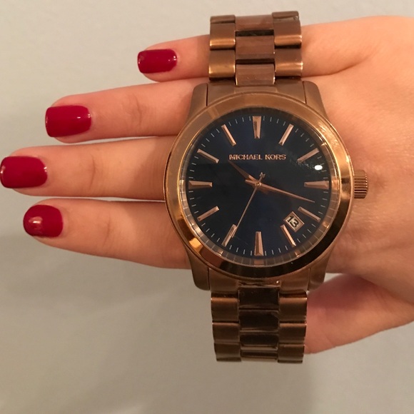 Unisex Michael Kors rose gold watch with blue face