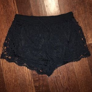 Black lace shorts.