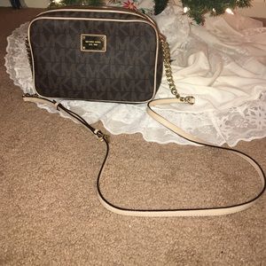 Brown and tan Michael Kors over the shoulder purse
