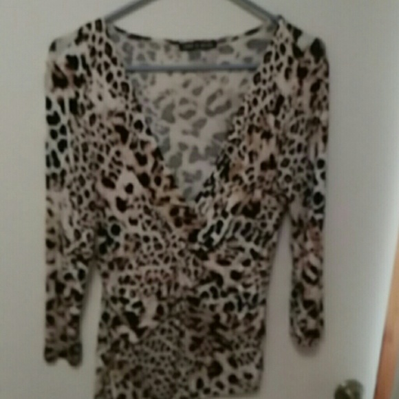 Leopard print for  hugs theshows a little cleavage