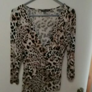 Leopard print for  hugs theshows a little cleavage