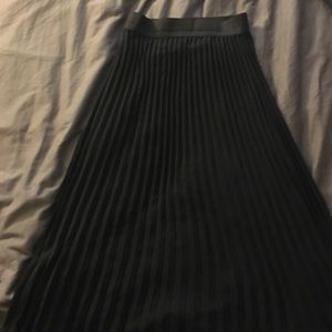 Long black pleated skirt