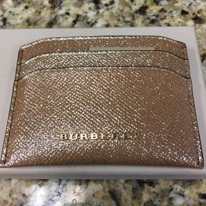 Burberry gold cardholder...