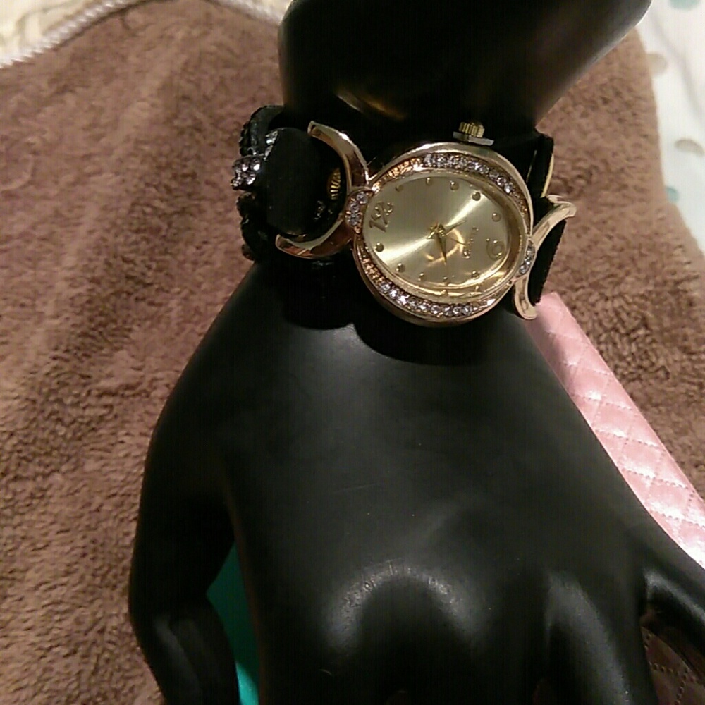 Rhinestones bracelet quartz watch.