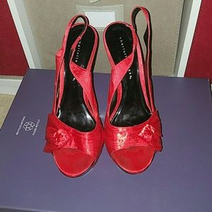 Red satin heels.