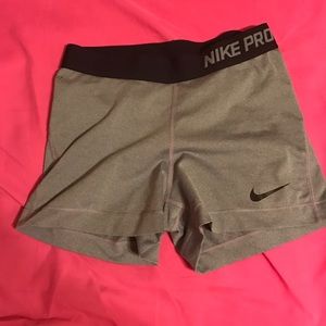 Grey and black Nike pros