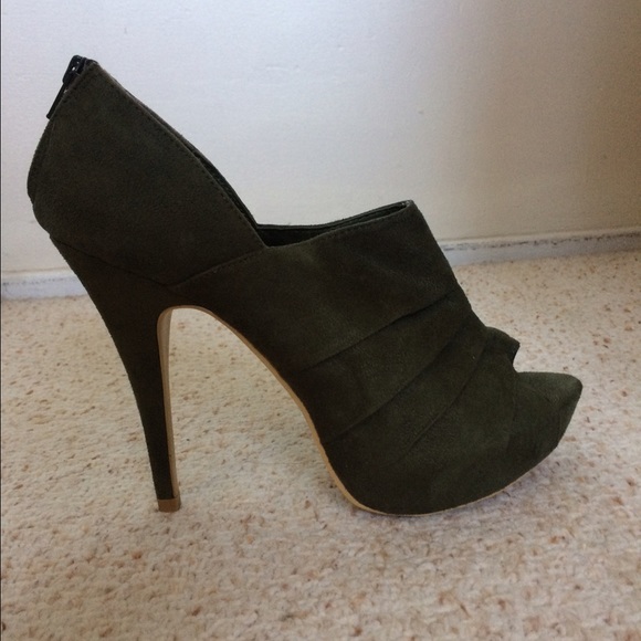 Suede green  heels with zipper on back. Never worn