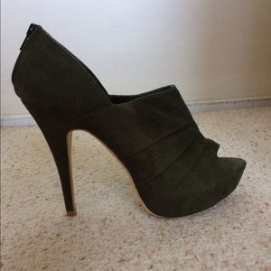 Suede green  heels with zipper on back. Never worn