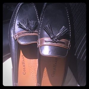 A brand new pair of Cole Jan slides