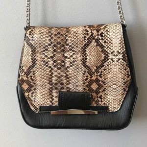 Black and snake print purse