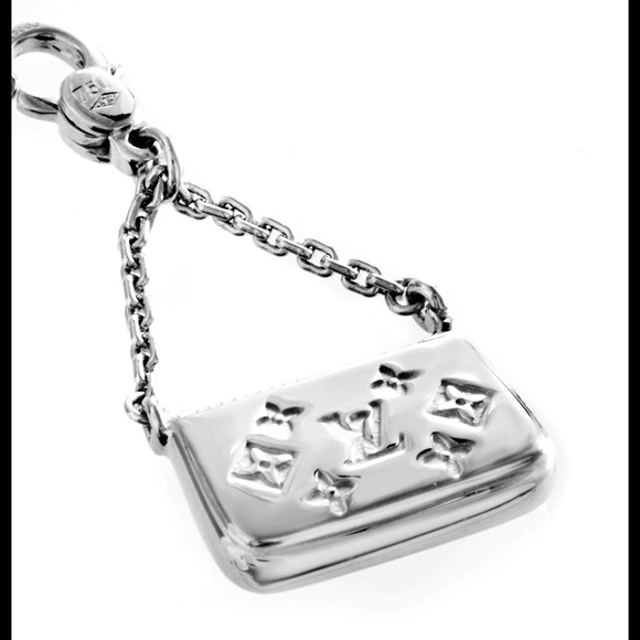 Louis Vuitton while gold charm/pendant