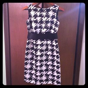 Modern black and white dress with low back & belt