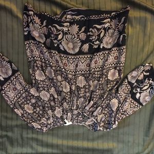 Beautiful top with small button around neckline.