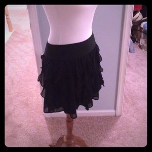 Black ruffle mini skirt