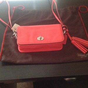 Coach coral cross body with tassel