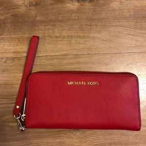 Michael Kors NEVER USED wristlet wallet in red.