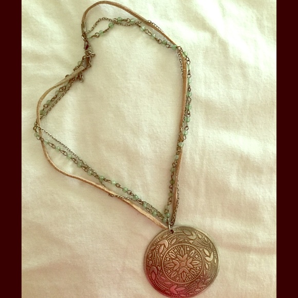 Jade colored beads, leather and large emblem