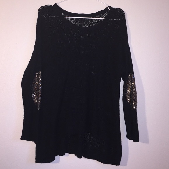 Black knit sweater with gold sequin elbow patches
