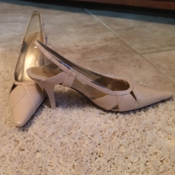 Women beige pair of shoes