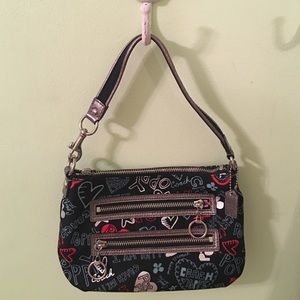 Black Coach purse with print. Never been used