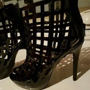 Black patten leather net patterned booties.